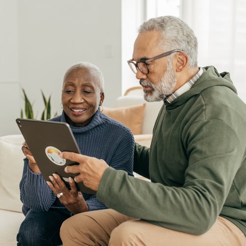 Senior couple looking at a tablet